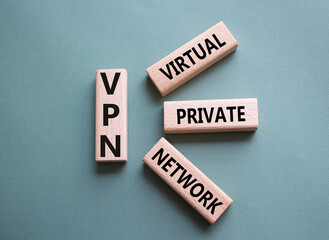 VPN - Virtual Private Network. Wooden cubes with word VPN. Beautiful grey green background. Business and VPN concept. Copy space.