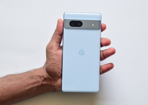 Man holding Google Pixel 7A smartphone. Taoyuan, Taiwan - 6th August, 2023.