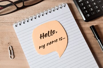 Self introduction concept. Speech bubble with the writing hello my name is on desk.
