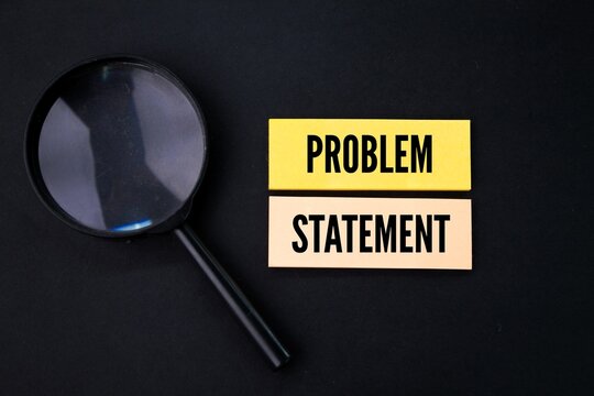 with a magnifying glass and colored paper with the word problem statement