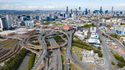 Aerial drone view of the Bowens Hill Interchange in Bowen Hills, Brisbane, Queensland Australia showing Brisbane City cbd in the background  - obrazy, fototapety, plakaty