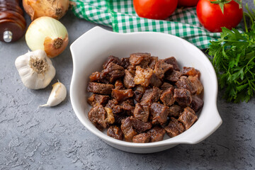 Muslims Traditional Sacrifice holiday food lamb, Turkish roasted meat in copper pot on table top. Turkish Kavurma. (Turkish name; Kurban kavurma)