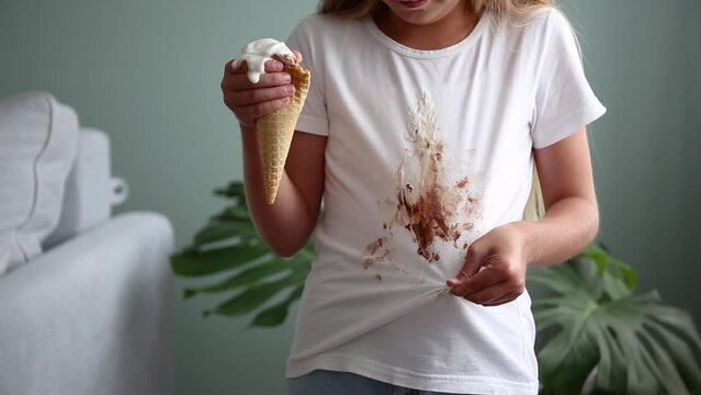 The child stained his clothes with ice cream.