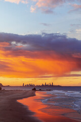 Colourful sunset sky over Currumbin Rock and Gold Coast skyline. View from Elephant Rock. Gold Coast, Australia