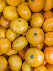Lots of tangerines vertical photo top view