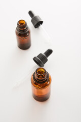 Amber mini bottles mockups with pipettes.