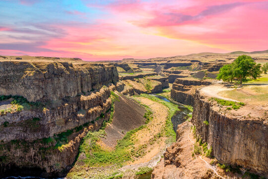 desert canyon with a colorful sky located at Palouse Falls in eastern Washington