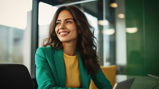 Confident, smiling Hispanic businesswoman in green attire; entrepreneur or customer service rep, specialized in finance or tech.