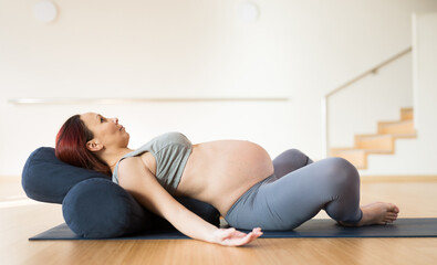Pregnant woman is engaged in yoga