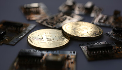 Coin crypto currency bitcoin against the background of a changing chart subject gold exchange pyramid for money. Connection with the growth or fall exchange rate closeup.