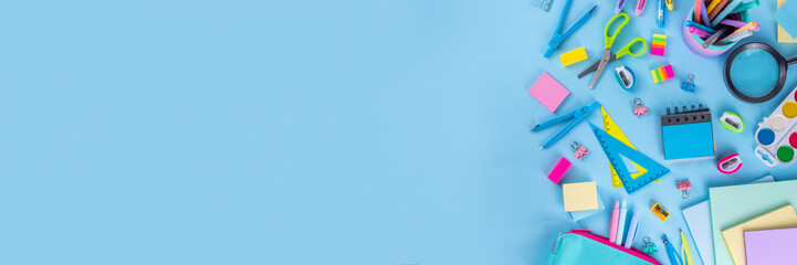 School equipment high-colored bright blue flat lay. Various school education and office supplies, accessories. Back to school sale background top view copy space © ricka_kinamoto