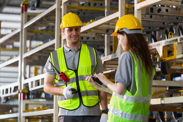 Male and female using tablet and use bar code reader while scanning  checking inspect goods auto parts on shelves in warehouse. logistic import export auto parts. Checklist stock product in storage.