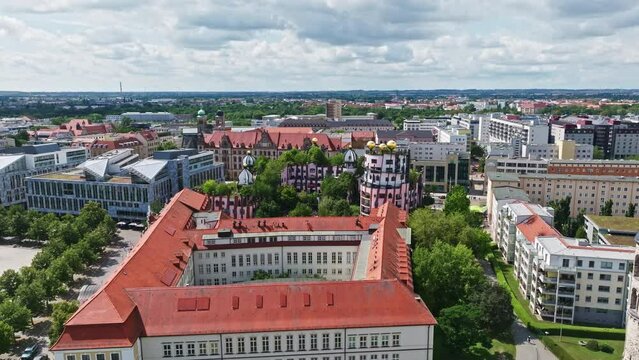 Aerial Drone shot of the Green Citadel (Gr&uuml;ne Zitadelle) by Friedensreich Hundertwassers in Magdeburg city, Saxony-Anhalt, Germany .