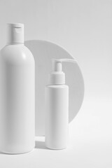 Bottles with cosmetic products on white background