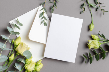 Blank wedding invitation card mockup with white envelope and flower, mock up with copy space