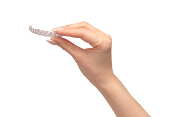 Transparent mouth guard in a woman's hand isolated.