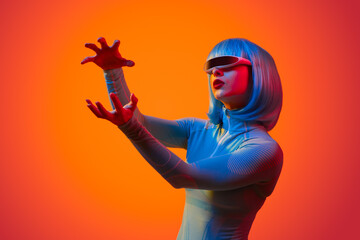 Futuristic woman forming invisible orb