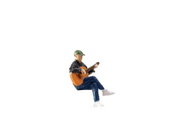 Miniature Musician with guitar isolated on white background with clipping path