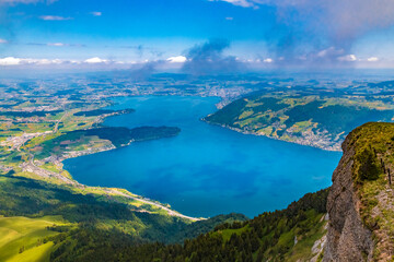 Fototapeta na wymiar Beautiful bird's-eye view of Lake Zug in Central Switzerland, viewed from the summit of Mount Rigi Kulm. It stretches for 14 km between Arth and the Cham-Zug bay.