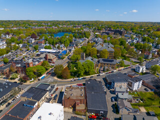 Historic commercial buildings aerial view on Main Street with Ell Pond at the back in historic city center of Melrose, Massachusetts MA, USA. 