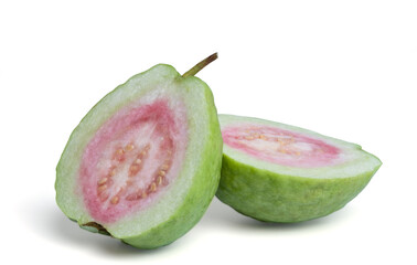 Organic guava fruit with stems and leaves, bright green skin, pink guava flesh, with leaves isolated on white background.