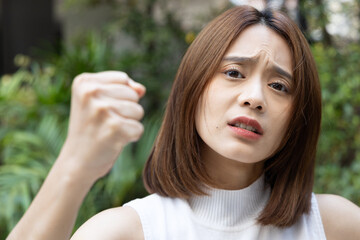 Confronting Emotions, Upset Woman with Intense Gaze Showing Anger