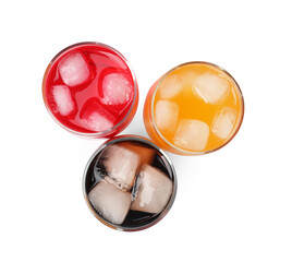 Glasses of different refreshing soda water with ice cubes on white background, top view