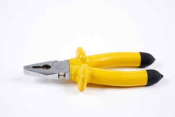 yellow pliers on a white background