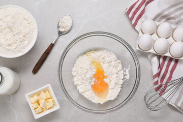 Different ingredients for making tasty baklava on light grey marble table, flat lay