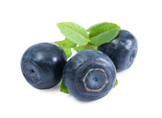 Tasty ripe bilberries and green leaves isolated on white