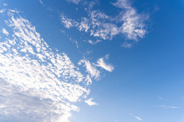 Blue sky and white fluffy tiny clouds background and pattern