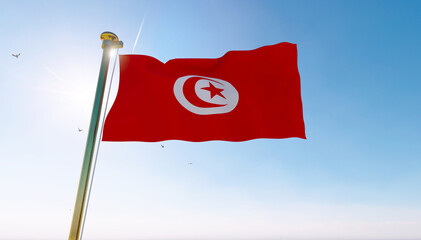 Flag of Tunisia waving in the wind, sky and sun background. Tunisia Flag.