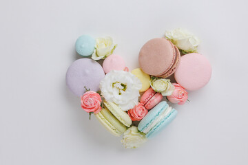 Beautiful heart made of Set colorful French macaroons and flowers. Valentines and mother day gift...