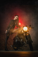 Fototapeta na wymiar Young beautiful girl with dark hair on the old motorbike.