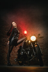 Plakat Young beautiful girl with dark hair on the old motorbike.