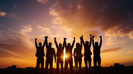 Group of business team members raising hands in the sunset sky background to depict teamwork