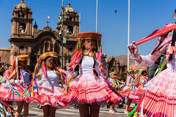 Dancers in typical costumes celebrate in honor of the Virgen del Carmen, in the square of Cusco,...