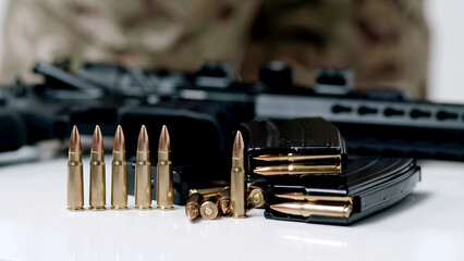 Hand taking ammo, bullets 762 caliber for ak47, gun crime military target war bullet weapon army military firearm, bullet pile, bullet shells, military concept, hunting ammo, close up - obrazy, fototapety, plakaty