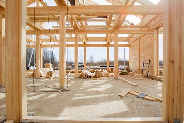 Wooden house frame. Construction of building from wooden beam. Frame of unfinished cottage....