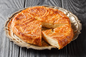 Kouign Amann is a pastry made with a lot of butter from the Brittany region of France closeup on...