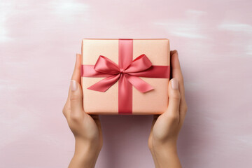 Beautiful golden gift box with red ribbon in woman's hands Generative AI