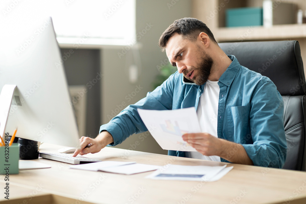 Poster Multitasking. Young Businessman Working On Computer, Talking On Cellphone And Checking Documents
