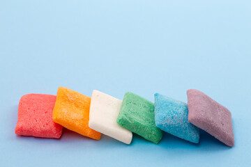 Rainbow Freeze Dried Candy Fruit Flavored Bar Candies on a Blue Background