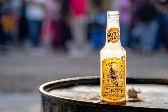 Open empty bottle of nutt khatt craft blended coffee sitting on barrel showing this popular foodtech brand