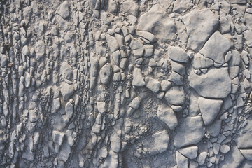 Cretaceous layered formations with stones in the steppe, texture of mineral formations