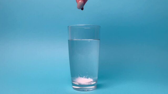 Effervescent tablet in a glass of water, soluble tablet for colds, treatment, weight loss.