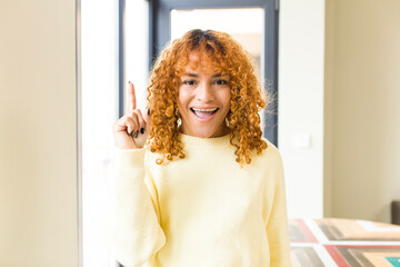 young red hair latin pretty womann at new cool home