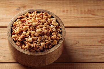 Hearty Breakfast Granola in Wooden Bowl. Top View