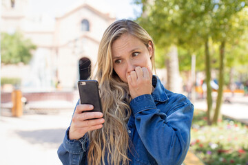 feeling scared, worried or angry and looking to the side. smartphone concept