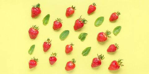 Many strawberries and mint leaves on color background